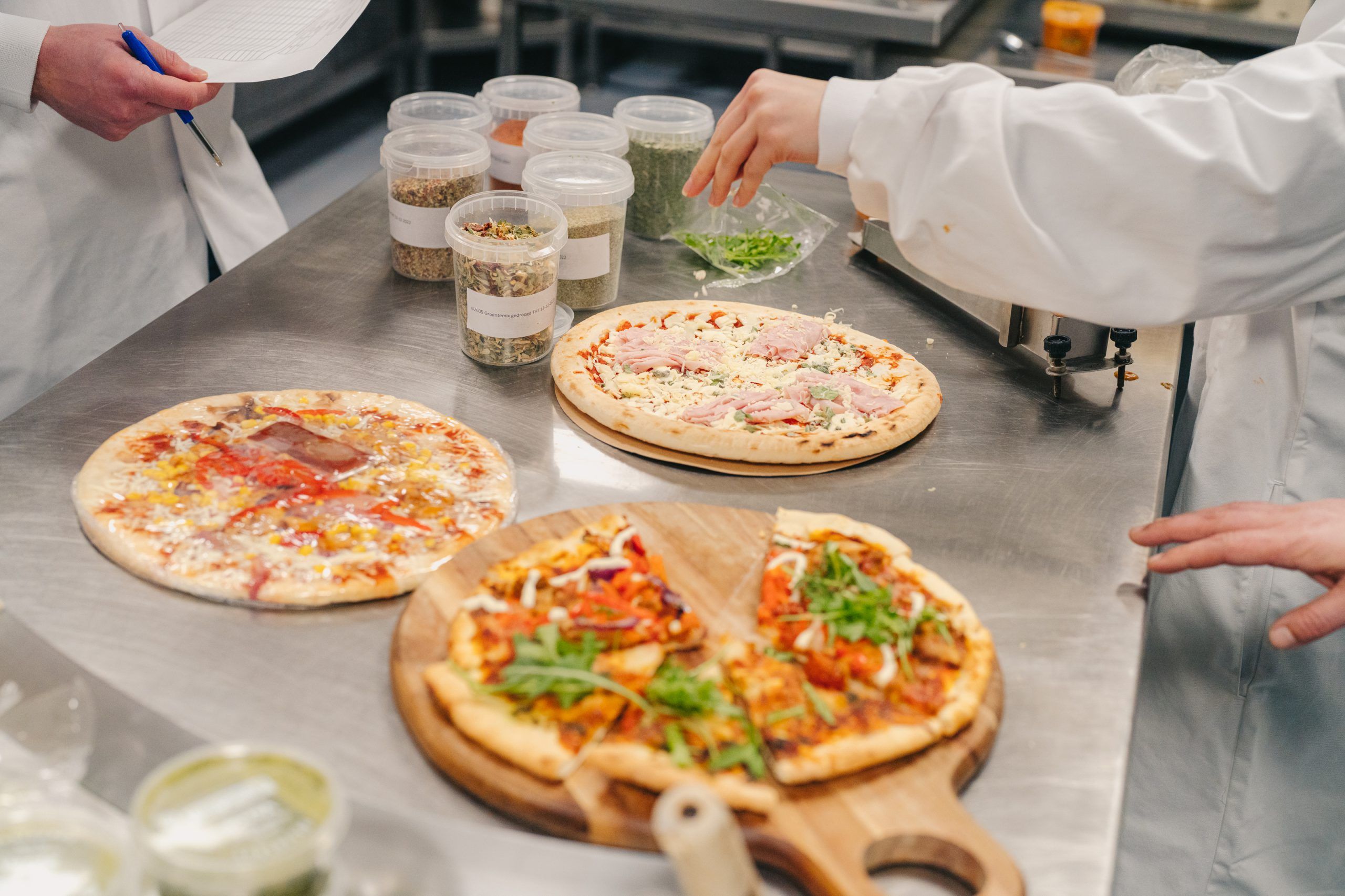 The final touches to the pizzas